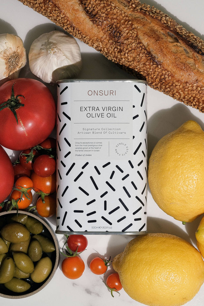 ONSURI Extra Virgin Olive Oil in package sitting on a cutting board 