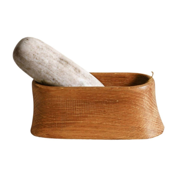 Oak Mortar and Marble Pestle displayed with peppercorns 