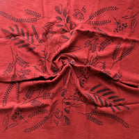 Red fabric with black floral patterns