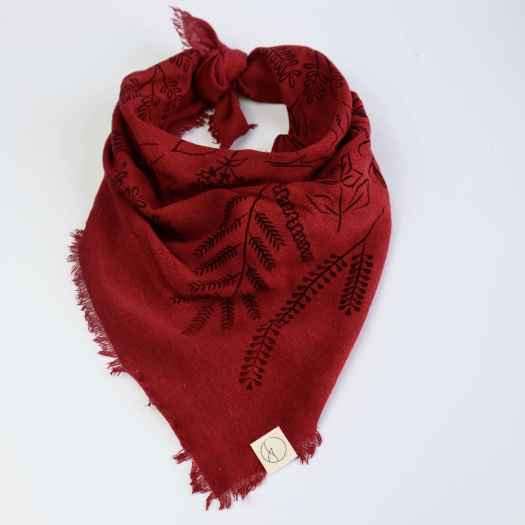 Red embroidered scarf on a white background