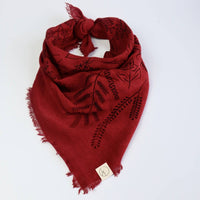 Red embroidered scarf on a white background