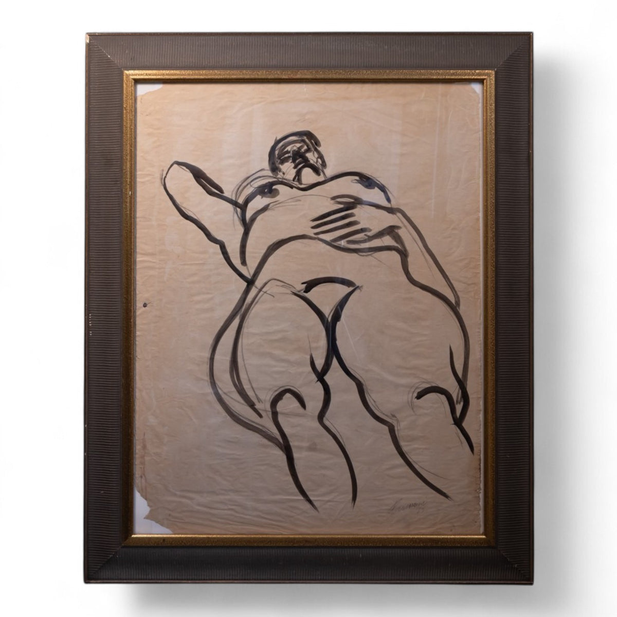 A framed art print featuring a black line drawing of two embracing figures on a textured beige background, enclosed in a dark brown textured frame with a gold inner border.