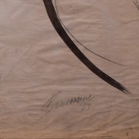 A close-up of a beige or cream-colored textured paper with a large dark brown curved brushstroke and a faint handwritten signature near the bottom center.