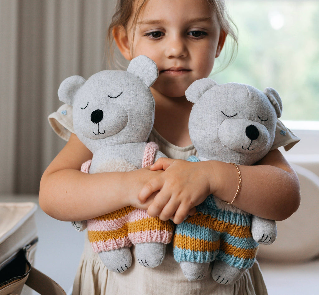 Spencer Bears being held by a child 