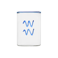 clear glass tumbler with blue rim and blue aquarius symbol modern nomad home decor store denver colorado CO