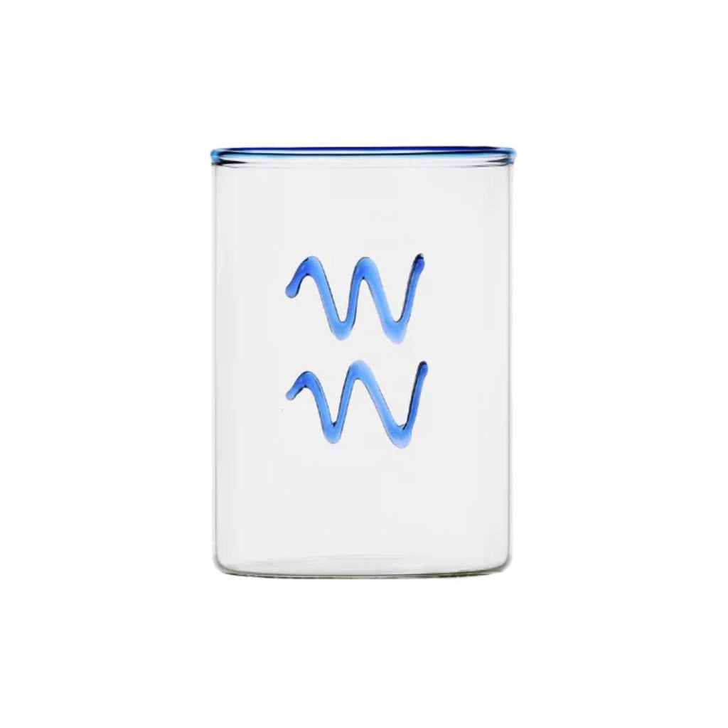 clear glass tumbler with blue rim and blue aquarius symbol modern nomad home decor store denver colorado CO