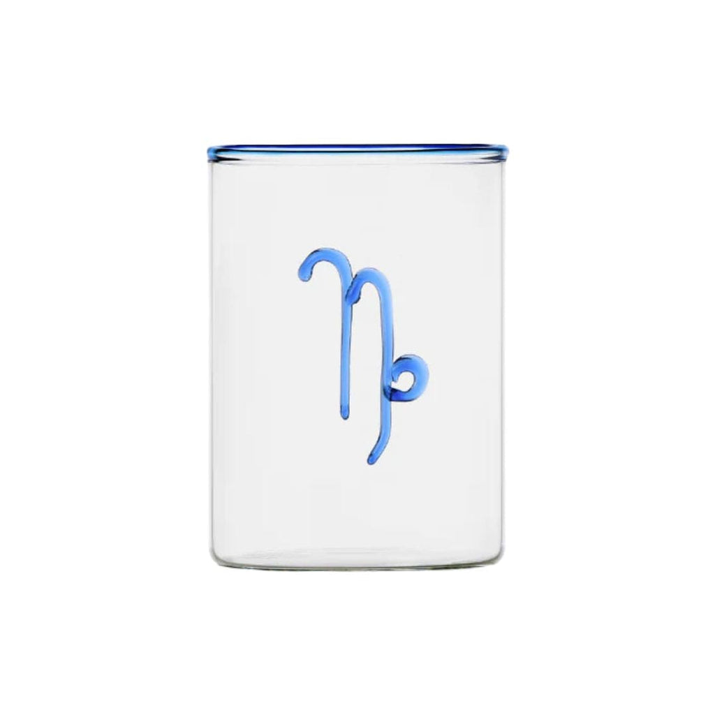 clear glass tumbler with blue rim and blue capricorn symbol modern nomad home decor store denver colorado CO