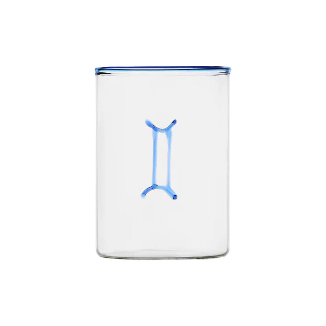 clear glass tumbler with blue rim and blue gemini symbol modern nomad home decor store denver colorado CO