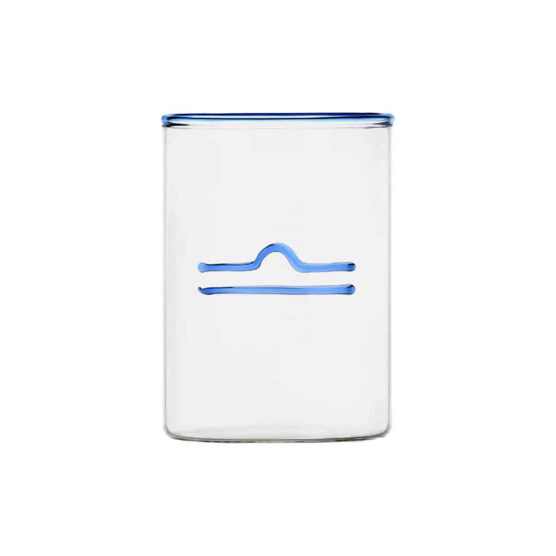 clear glass tumbler with blue rim and blue libra symbol modern nomad home decor store denver colorado CO