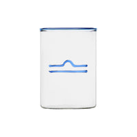 clear glass tumbler with blue rim and blue libra symbol modern nomad home decor store denver colorado CO