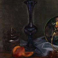 A still life painting featuring a tall dark blue glass vase, sliced peaches, a small dark jar, draped white fabric, and part of a decorative plate on a dark background.