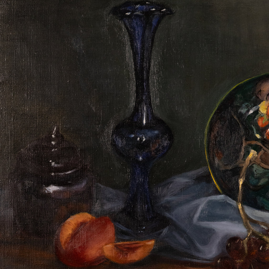 A still life painting featuring a tall dark blue glass vase, sliced peaches, a small dark jar, draped white fabric, and part of a decorative plate on a dark background.