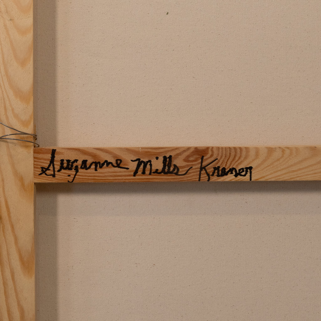 A close-up of a wooden art canvas or print frame, showing a light natural wood bar with the name 'Jazmine Milla Kramer' written in black script, mounted against a beige wall.