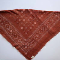 Brown patterned scarf on a white background
