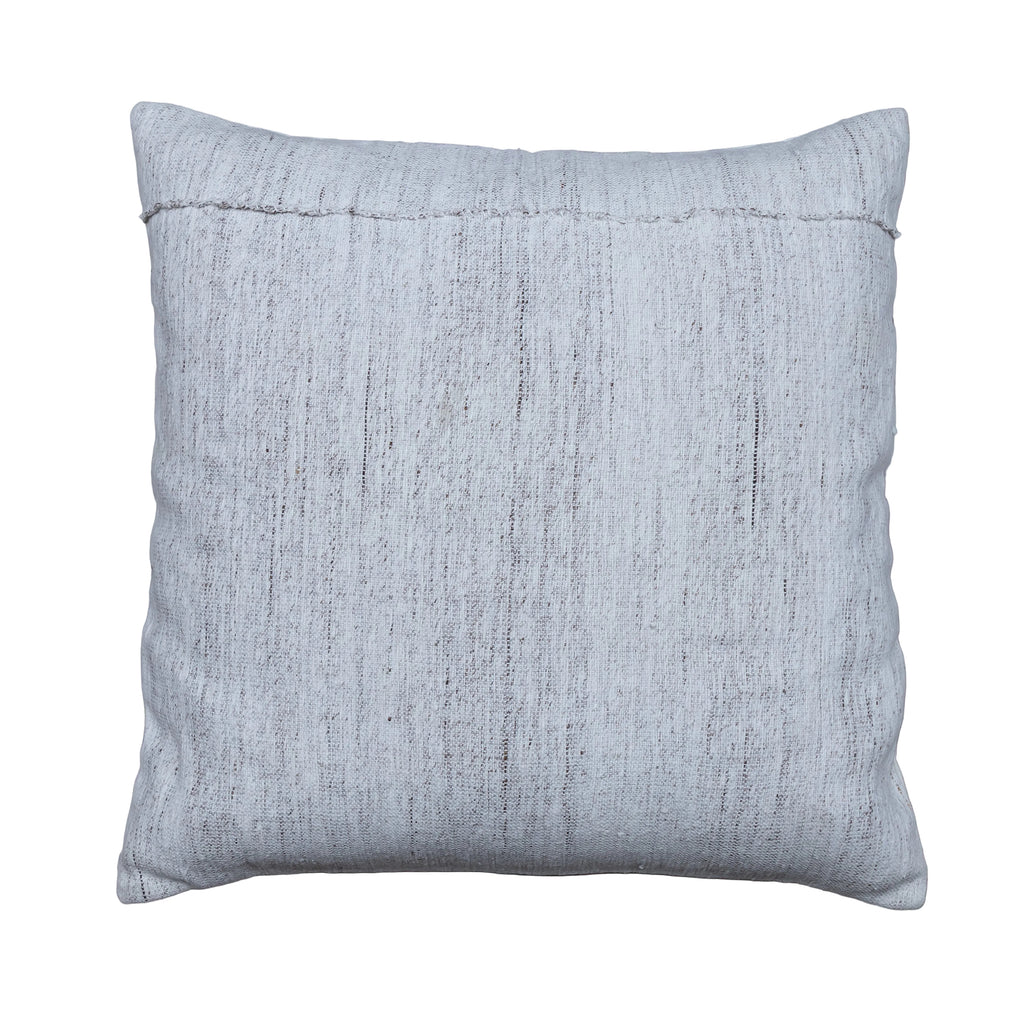 A square throw pillow in a textured light gray linen-like fabric, displayed flat on a rustic gray wooden plank surface.