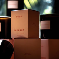 ROEN Topanga candles with a blurred background