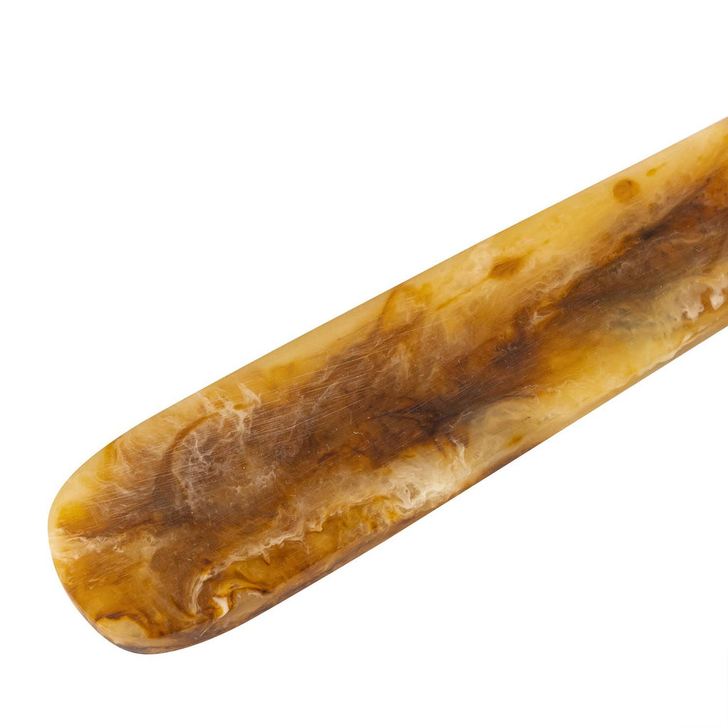 Handle of resin salad servers on white background.