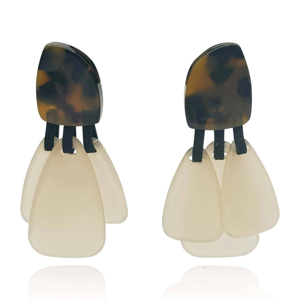 Pair of earrings with tortoiseshell top and beige bottom on a white background
