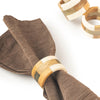 Travis Napkin Rings (set of 6) displayed with a brown napkin 