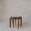 A set of three nested round nesting tables with a light gray marble top and curved bronze metal rims, supported by four curved wooden legs in a warm brown finish, set against a neutral light gray background.