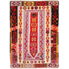 Handwoven Turkish Kilim rug in wool with vibrant lilac, red, yellow, and maroon geometric patterns