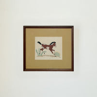 Framed artwork of a horse on a beige background