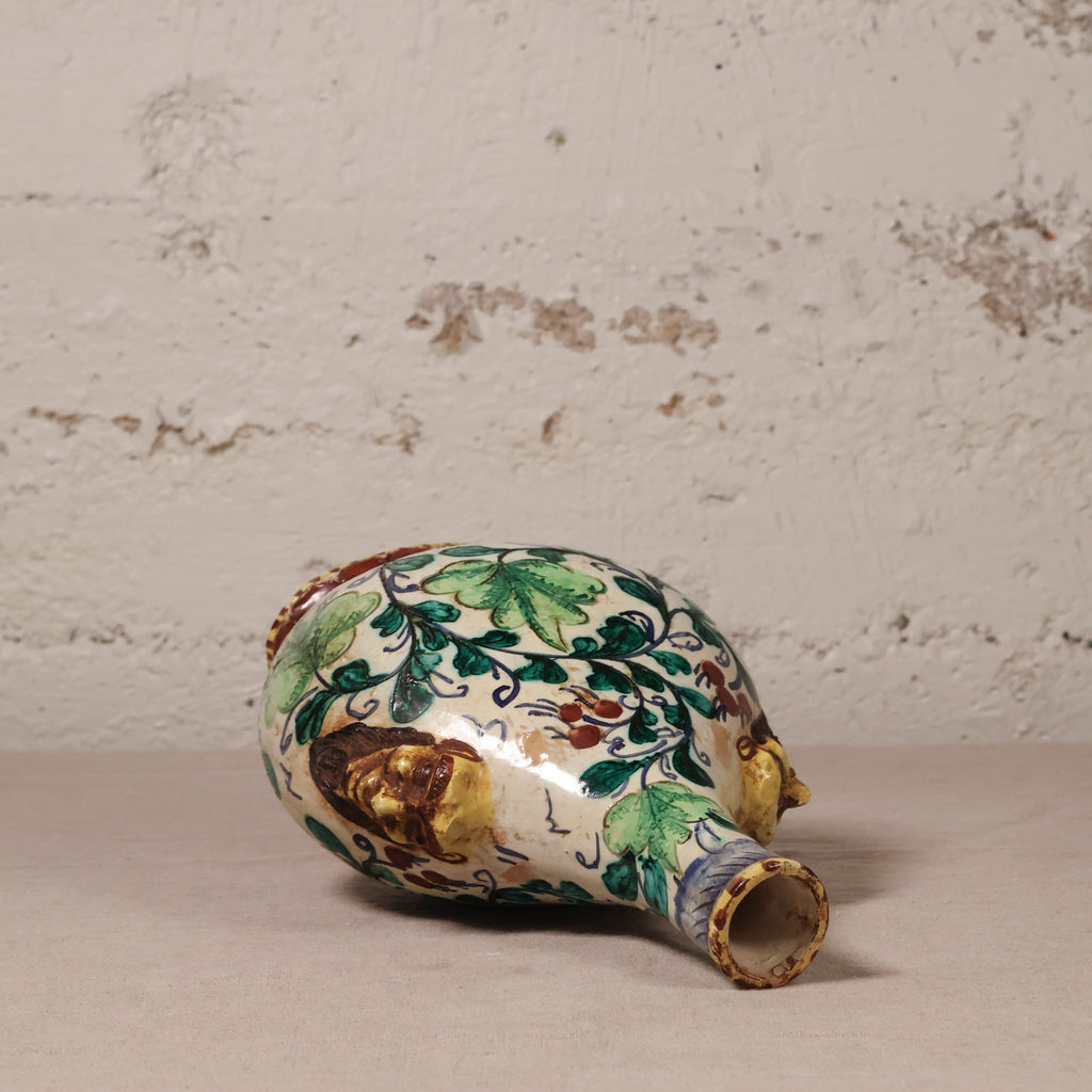Decorative ceramic vase with floral patterns on a textured surface