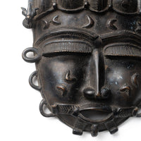 Vintage African bronze mask from Ivory Coast – reverse view