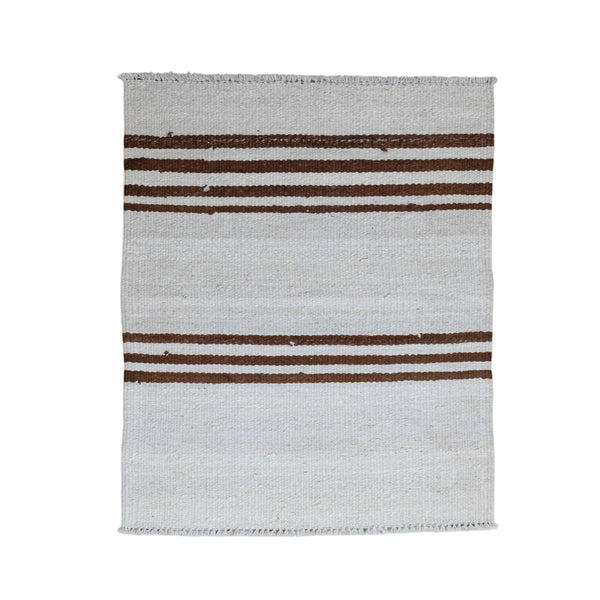 A rectangular woven rug with a light gray base and three vertical dark brown stripes, shown flat against a plain off-white background.