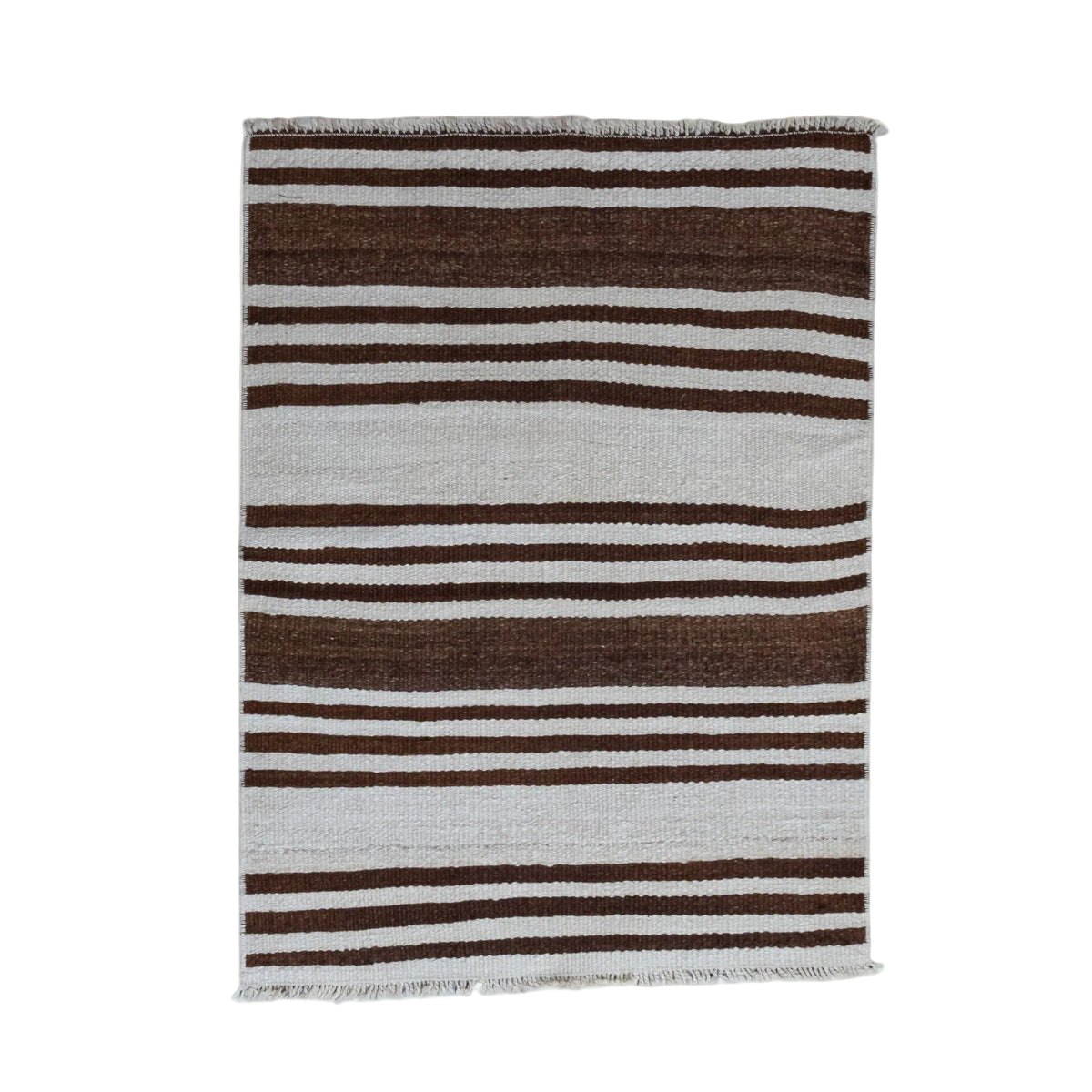 A rectangular woven textile with vertical stripes in dark brown, light gray, and white, featuring fringed edges, shown against a plain off-white background.