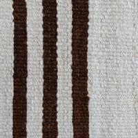 Close-up of a woven textile with vertical dark brown stripes on an off-white background.