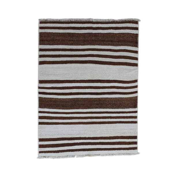 A rectangular woven textile with vertical stripes in dark brown, light gray, and white, featuring fringed edges, shown against a plain off-white background.