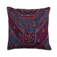 A square throw pillow featuring a detailed, vintage-style geometric and floral pattern in deep navy blue, magenta, and red, set against a plain off-white background.
