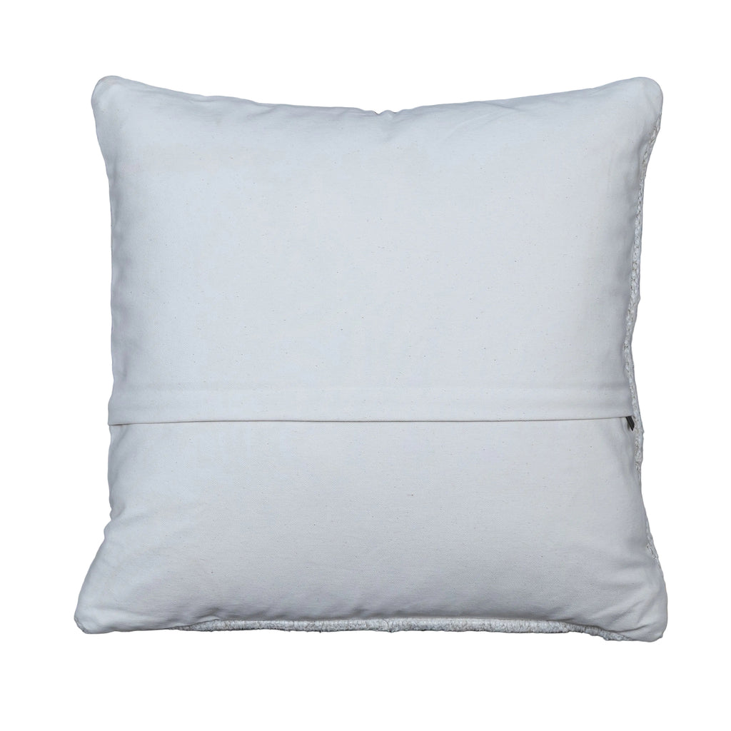 A square white throw pillow with a stitched hem, displayed flat on a rustic gray wooden plank background.