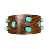 Wooden bracelet with turquoise stones on a white background