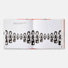 Open book with illustrations of black and white figures on a white background