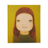 A hardcover art book by Phaidon featuring a stylized portrait of a child with reddish-brown hair and green eyes on a mustard yellow background.