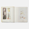 Open book displaying artistic illustrations on a white background