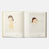 Open book with illustrations of a child in a yellow dress on a white background