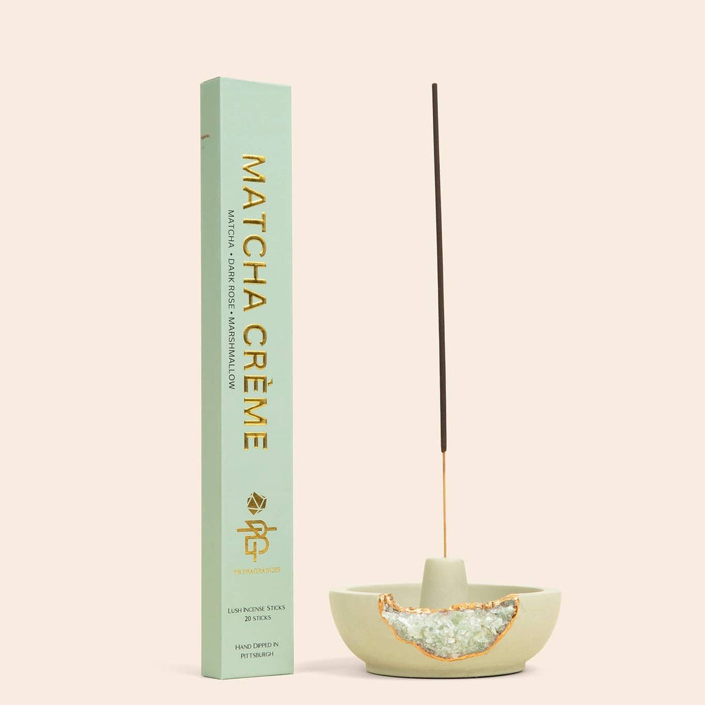 Incense stick and holder next to Matcha Crème box.