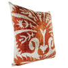 Orange and white patterned throw pillow.