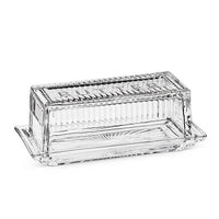 Clear glass butter dish with 'Butter' text on a white background