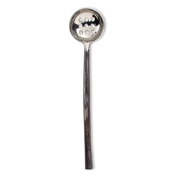 Silver slotted spoon on a white background