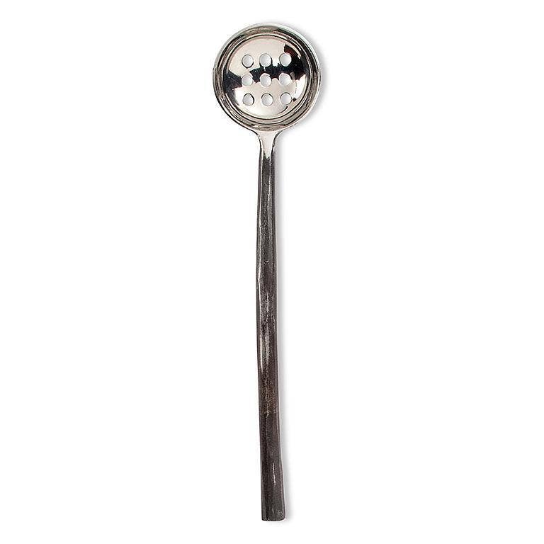 Silver slotted spoon on a white background
