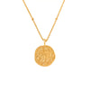 gold necklace with a round taurus zodiac pendant
