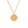 gold necklace with a round pisces zodiac pendant