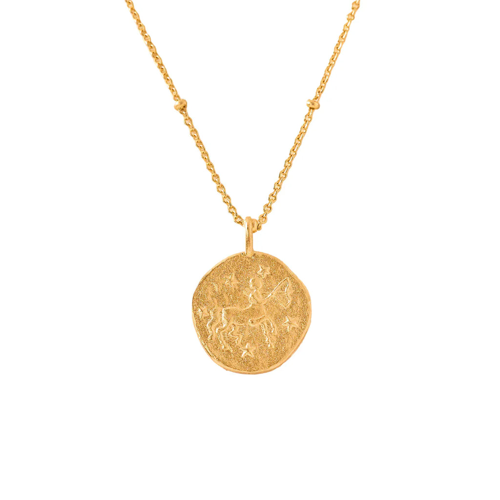 gold necklace with a round sagittarius zodiac pendant