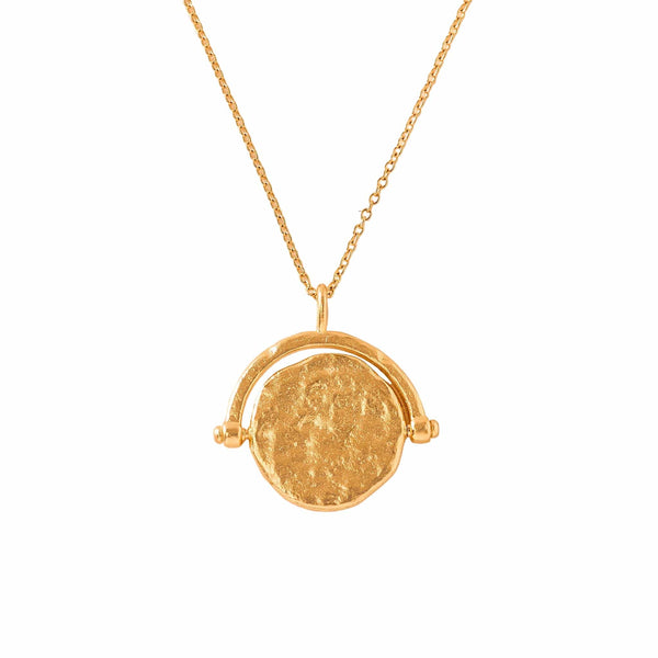 Gold necklace with a round pendant modern nomad home decor store denver colorado CO