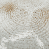 Close-up of a textured surface with speckles
