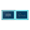 Open book with blue pages showing text and a constellation diagram on a white background